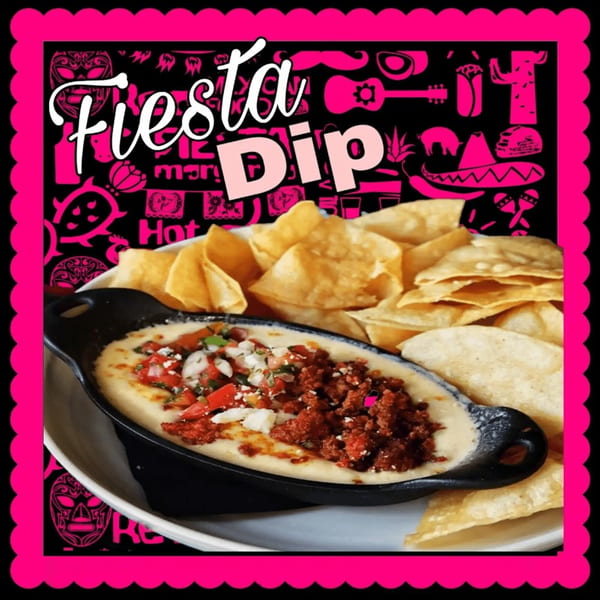 The Taco Shop's Fiesta Dip, a skillet of queso with chorizo and pico de gallo, served with tortilla chips.