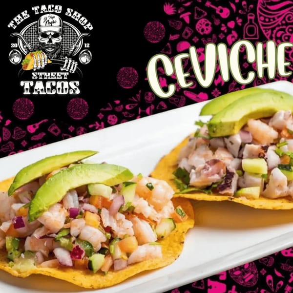 Two ceviche tostadas topped with diced shrimp, vegetables, and avocado slices on a white plate.