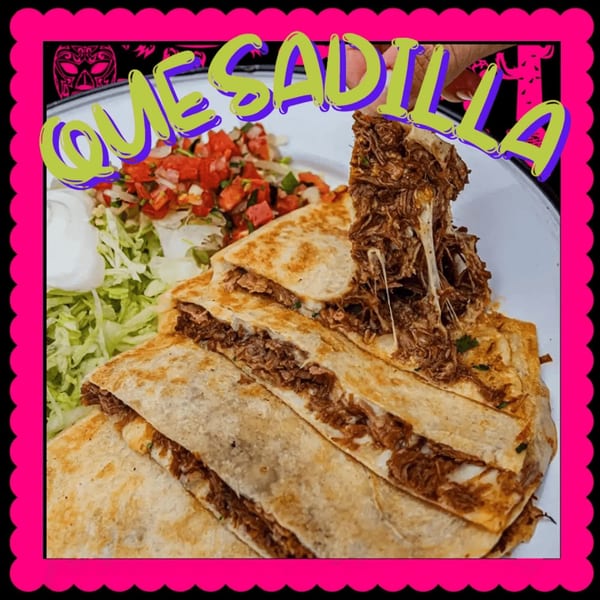 A beef quesadilla from The Taco Shop, with cheese pull, pico de gallo, lettuce, and sour cream.